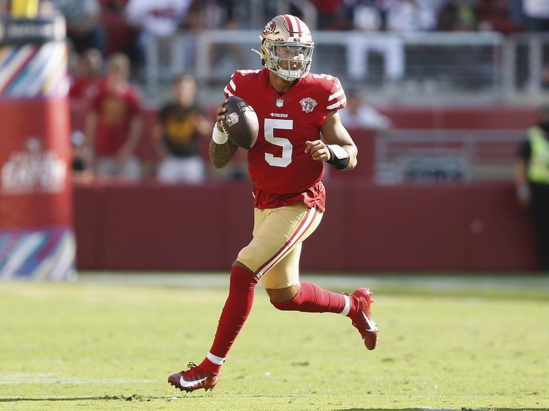 San Francisco 49ers quarterback Trey Lance looks to pass ball