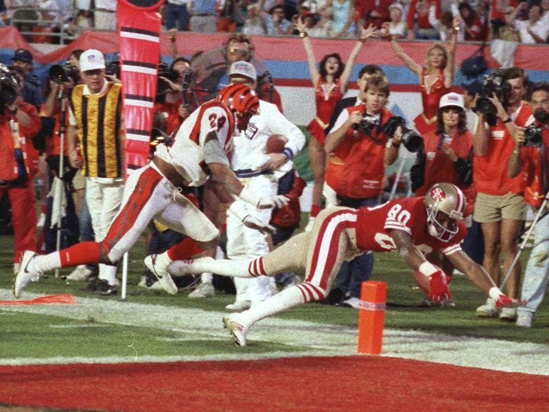 San Francisco 49ers wide receiver Jerry Rice dives into end zone