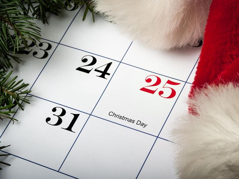 Santa hat laying on a Christmas calendar