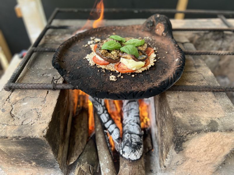 Santo Domingo handmade yuca pizza over wood fire