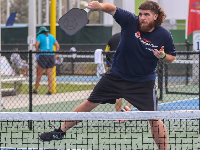 Scoring a point in pickleball with a mullet