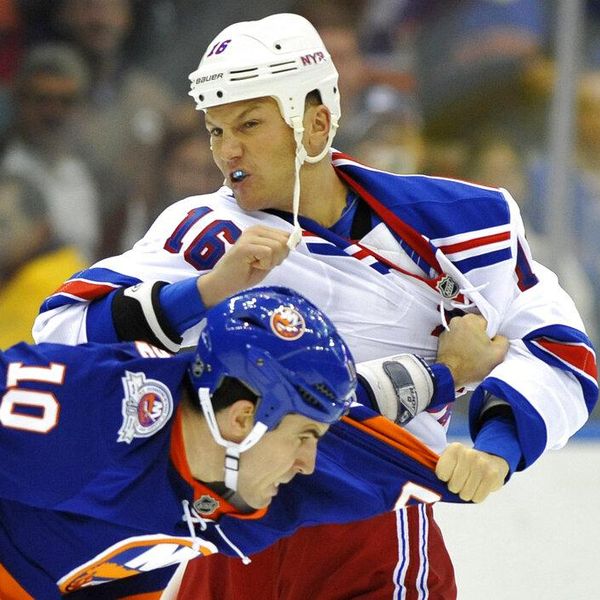 New York Rangers' Sean Avery (16) fights with New York Islanders' Mike Mottau (10) during the second period of an NHL hockey game on Tuesday, Nov. 15, 2011, in Uniondale, N.Y. (AP Photo/Kathy Kmonicek)
