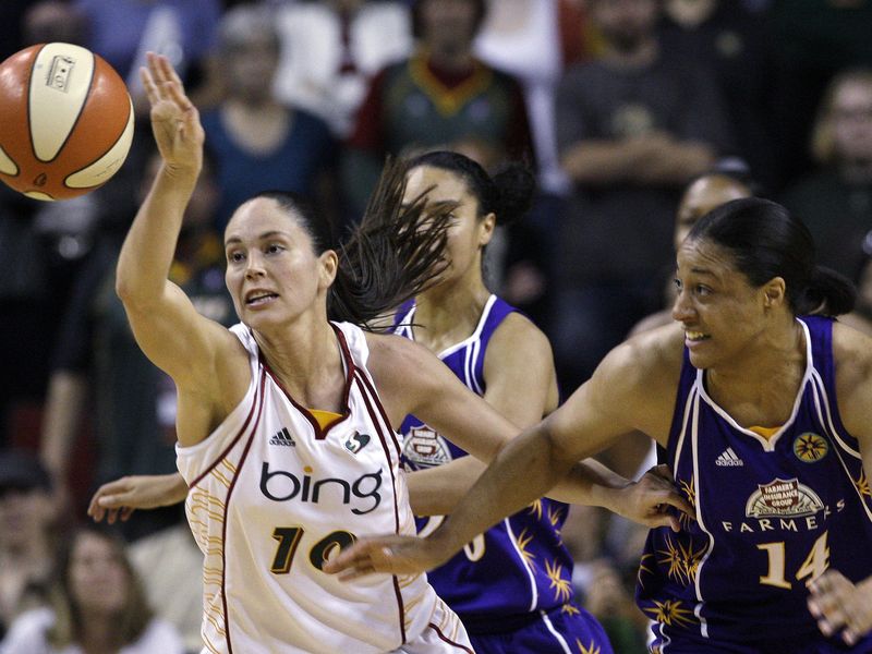 Seattle Storms' Sue Bird beats Los Angeles Sparks' Lindsay Wisdom-Hylton to loose ball