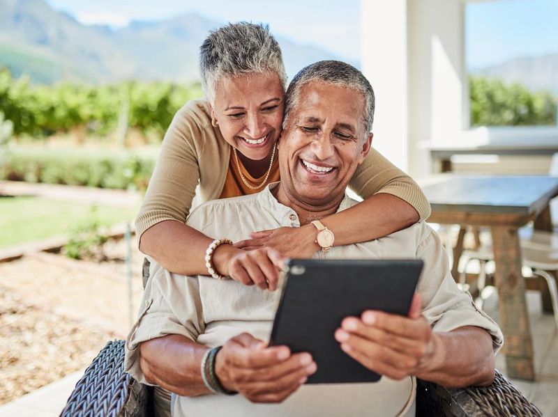 Senior couple using a tablet for video call