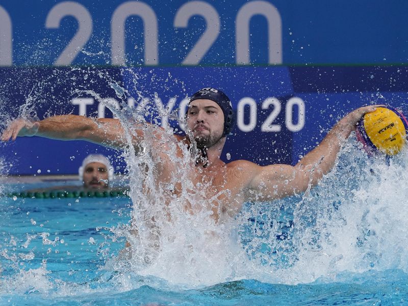 Serbia's Dusan Mandic shoots against Greece during men's water polo gold medal match at 2020 Summer Olympics