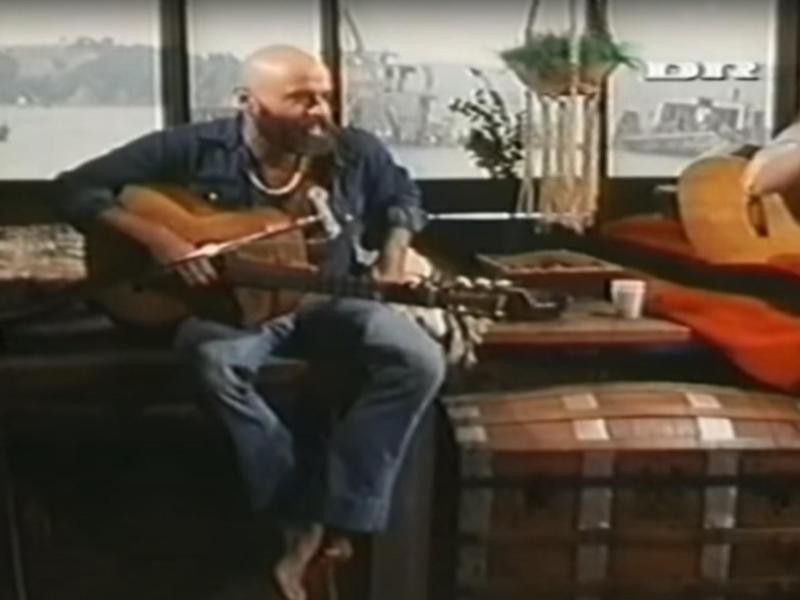 Shel Silverstein playing guitar