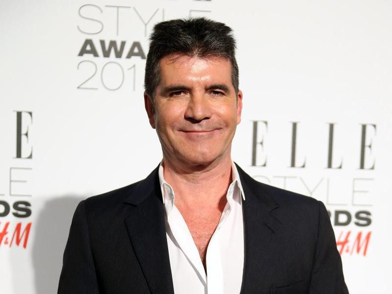 Simon Cowell poses at Elle Style Awards