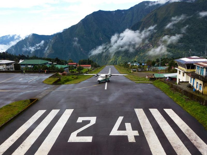 Small plane landing at the "Tenzing-Hillary" Airport in Lukla, Everest Base Camp trek, Nepal