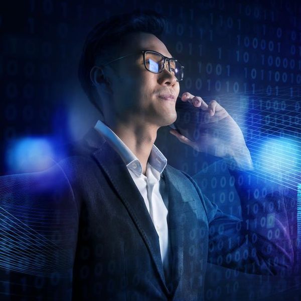 smart Asian business man using mobile phone with financial investment digital technology, futuristic artificial intelligence tech and finance graph symbol effect.