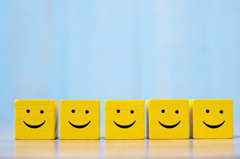 Smiles on yellow cubes