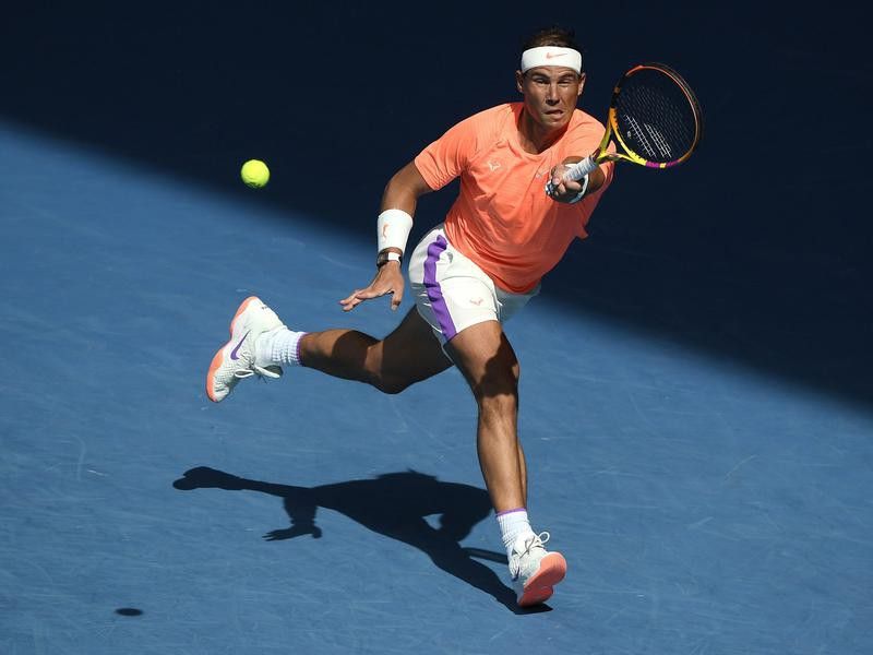 Spain's Rafael Nadal hits forehand return