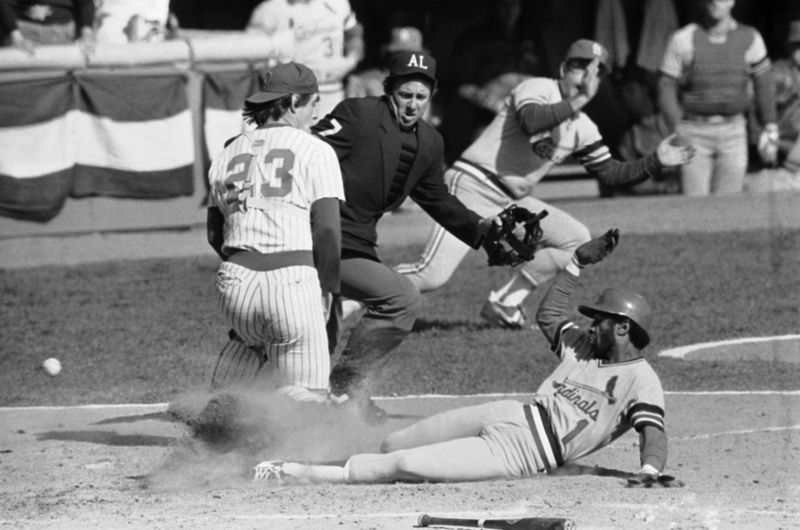 St. Louis Cardinals runner Ozzie Smith scores in the 1982 World Series as the ball gets past Milwaukee Brewers catcher Ted Simmons