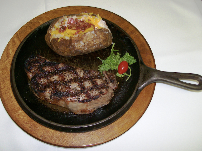 Steak and baked potato at Binion’s Roadhouse