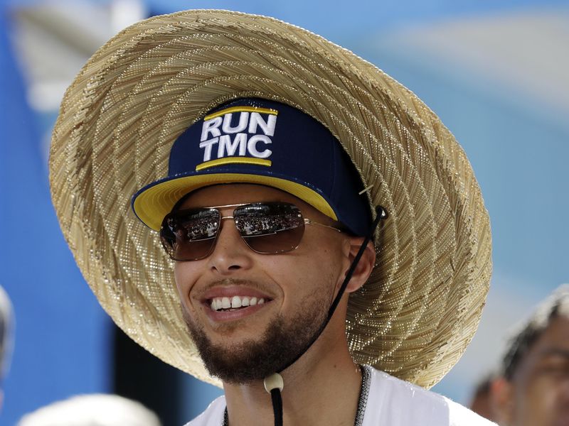 Steph Curry smiles during Warriors championship parade in 2018