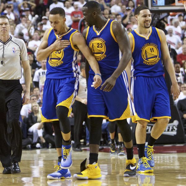 Golden State Warriors guard Stephen Curry, left, guard Klay Thompson, right and forward Draymond Green, center, react during the second half of Game 4 of an NBA basketball second-round playoff series against the Portland Trail Blazers Monday, May 9, 2016, in Portland, Ore. The Warriors won 132-125. (AP Photo/Craig Mitchelldyer)