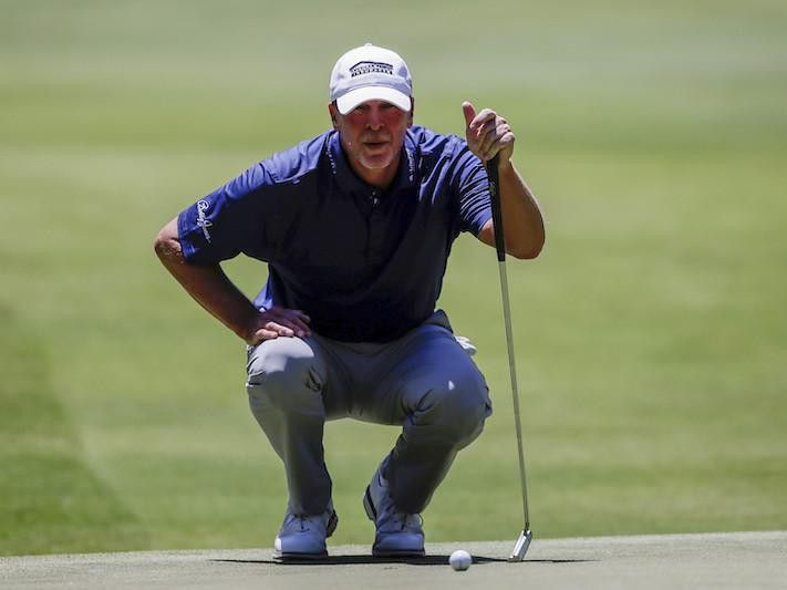 Steve Stricker lines up for his putt on fifth hole