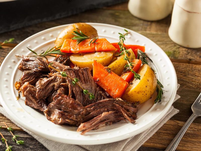 Strewed meat with carrots and potatoes