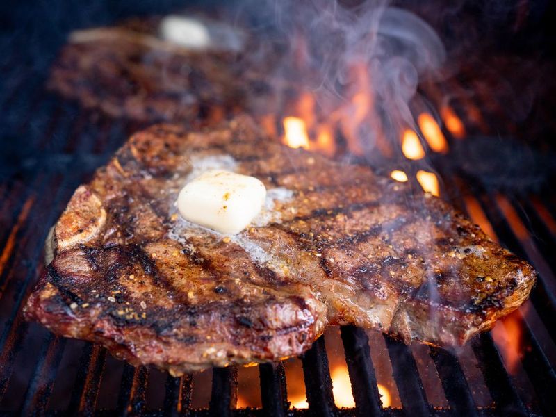 T-bone beef steak cooked over flame grill