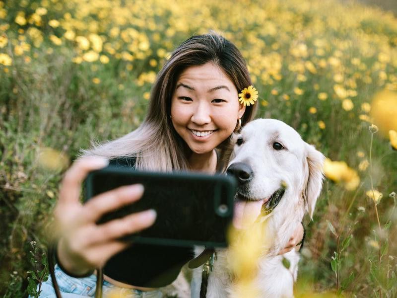 Taking a picture with a dog