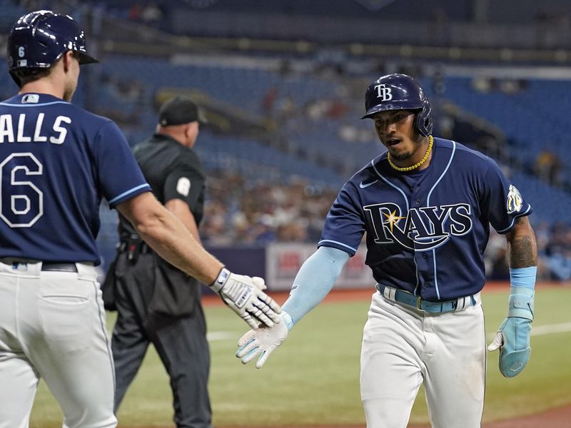 Tampa Bay Rays shortstop Wander Franco celebrates with Taylor Walls after scoring