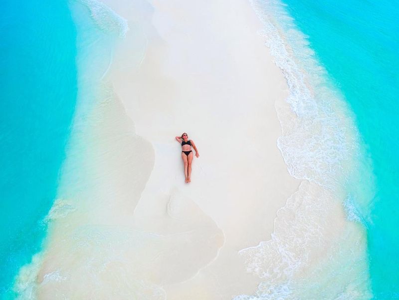 Tans on a sandbank in the Maldives