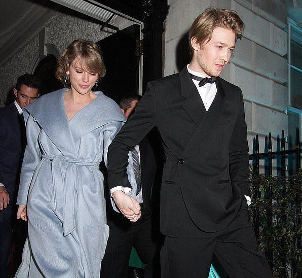 Taylor Swift and Joe Alwyn holding hands