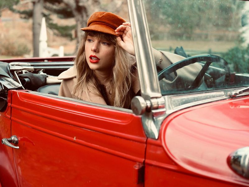 Taylor Swift sitting in a car