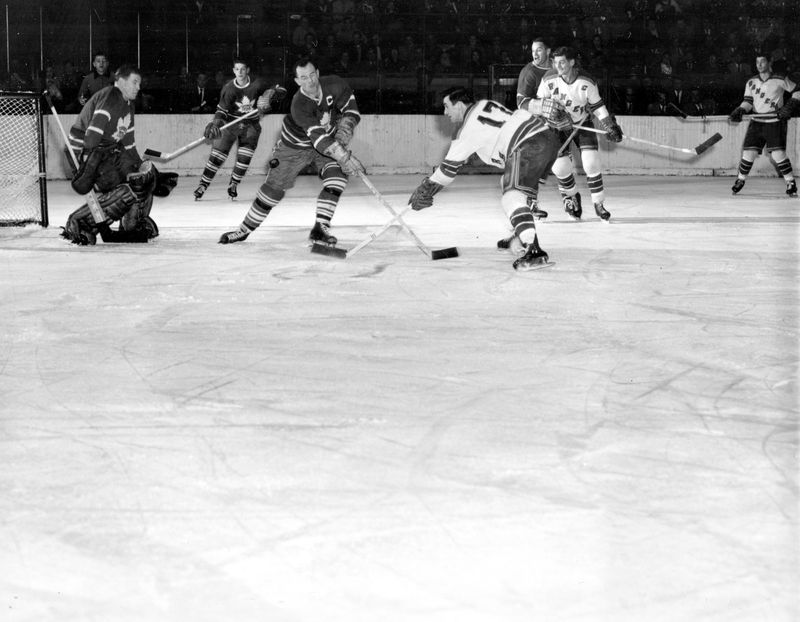 Ted Kennedy deflects the puck