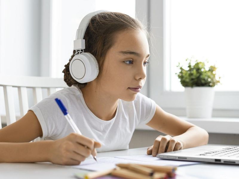 Teenager girl doing homework at home