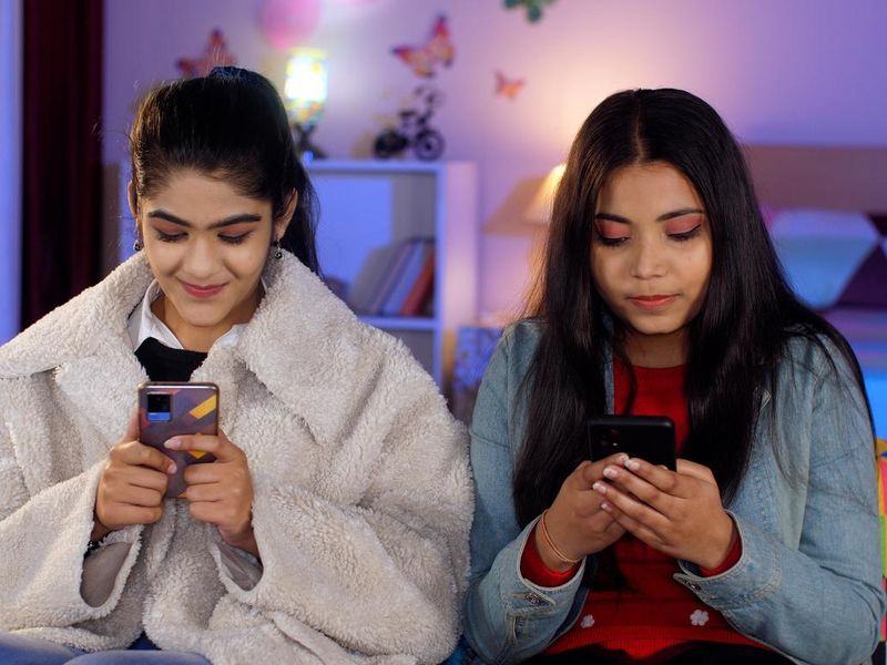Teenagers on their smartphones