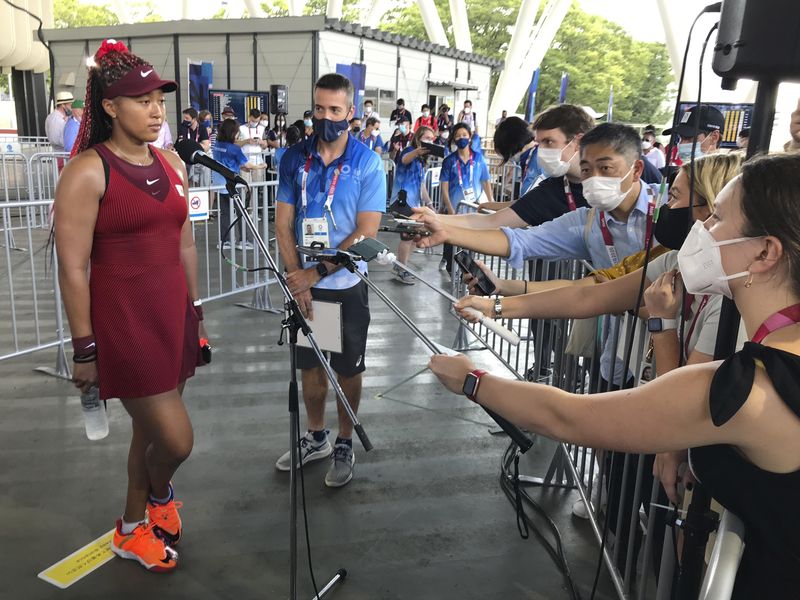 Tennis player Naomi Osaka speaks with journalists