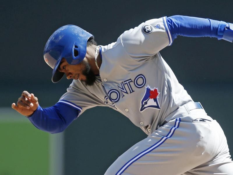Teoscar Hernandez of the Blue Jays races to second base on a steal attempt