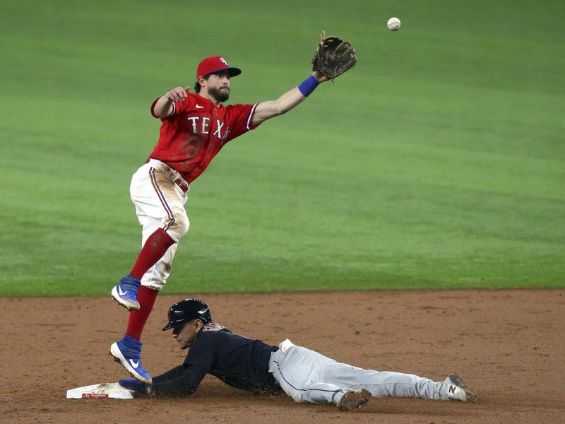 Texas Rangers second baseman Nick Solak leaps to catch ball as Cleveland Indians Andres Gimenez steals