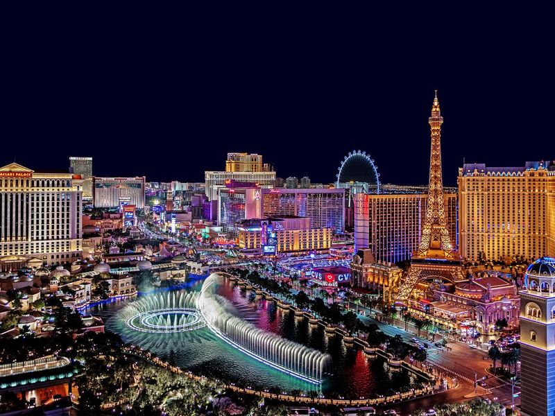 The famous Las Vegas Strip with the Bellagio Fountain. The Strip is home to the largest hotels and casinos in the world.