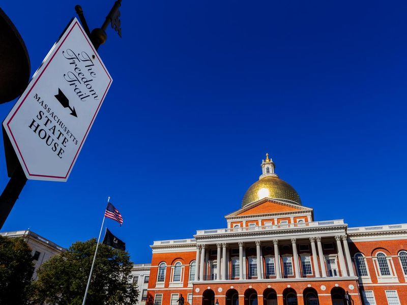 The Freedom Trail sign and the Massachusetts State House - Massachusetts Capitol - Boston Massachusetts