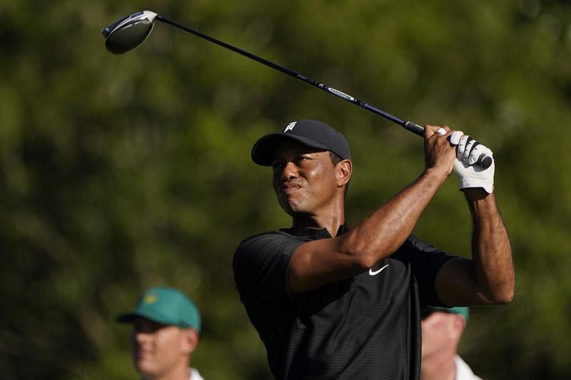 Tiger Woods watches his tee shot