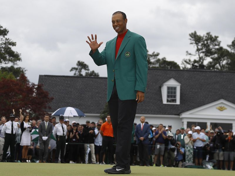 Tiger Woods wears his green jacket after winning the Masters golf tournament S