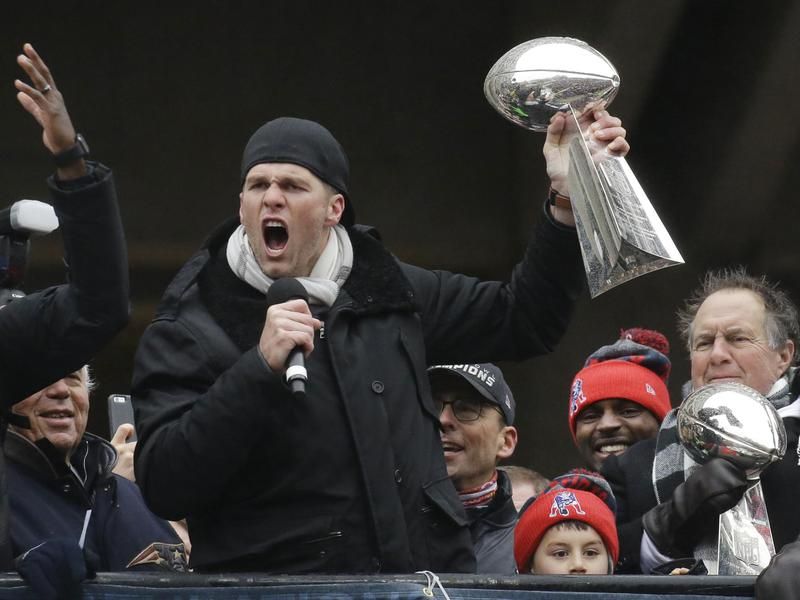 Tom Brady with a Super Bowl trophy