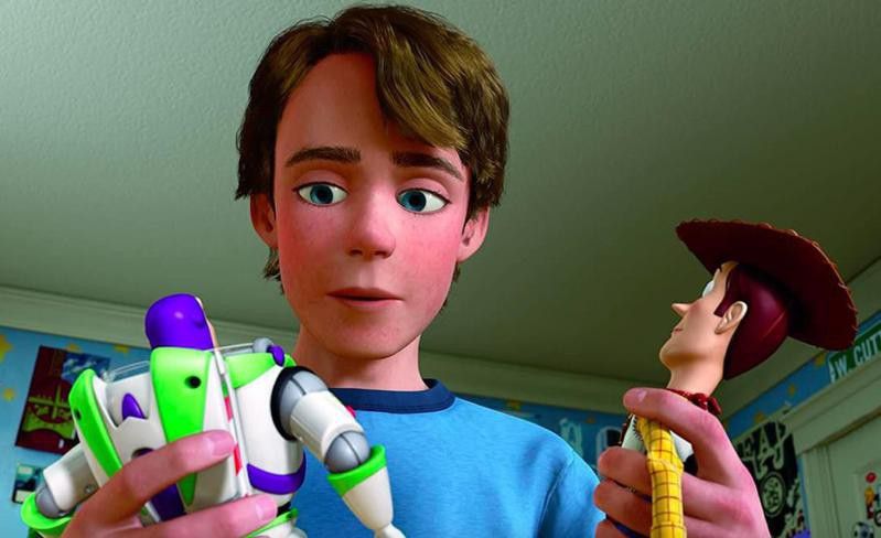 Tom Hanks, Tim Allen, and John Morris in Toy Story 3