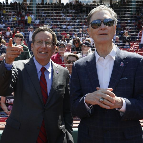 Boston Red Sox owner John Henry and Chairman Tom Werner before a baseball game against the Minnesota Twins, Friday, April 15, 2022, in Boston. (AP Photo/Michael Dwyer)