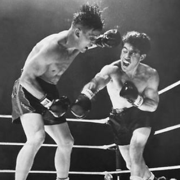Tony Zale throwing punches with Rocky Graziano