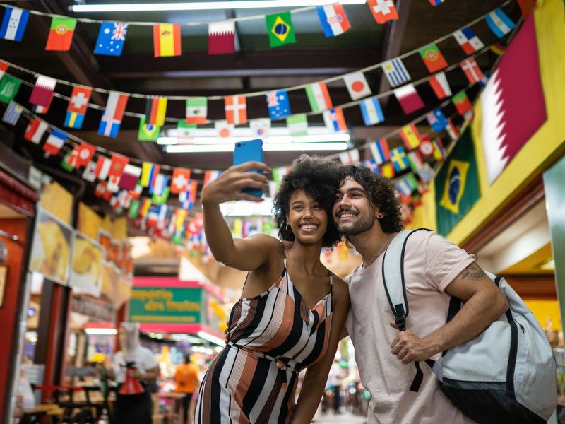 Travelers taking a selfie at the Municipal Market of São Paulo, Brazil
