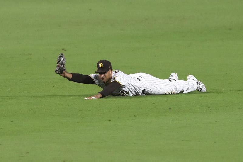 Trent Grisham of San Diego Padres makes diving catch