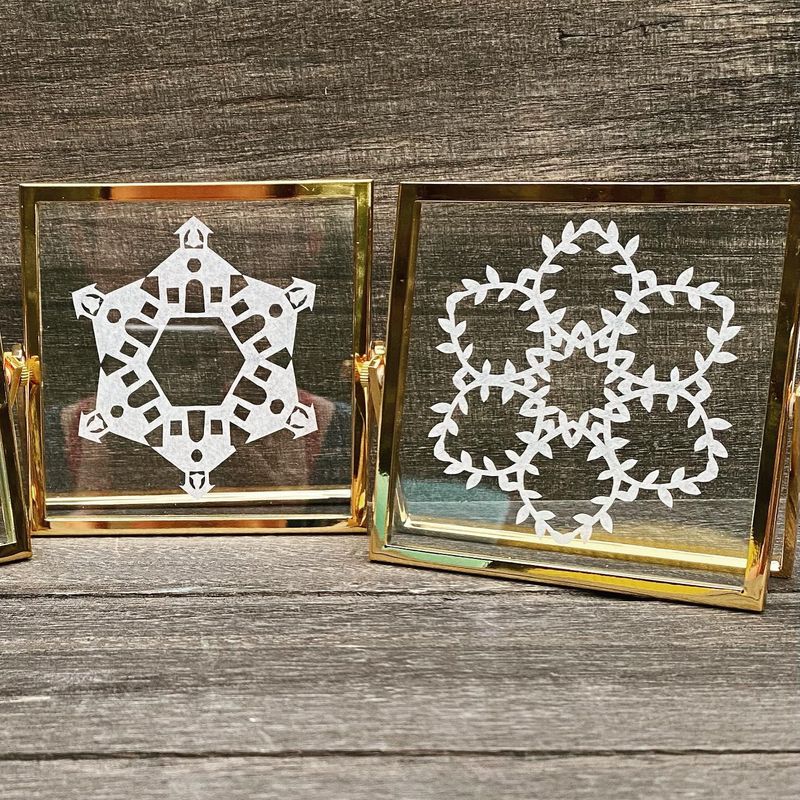 Two paper snowflakes