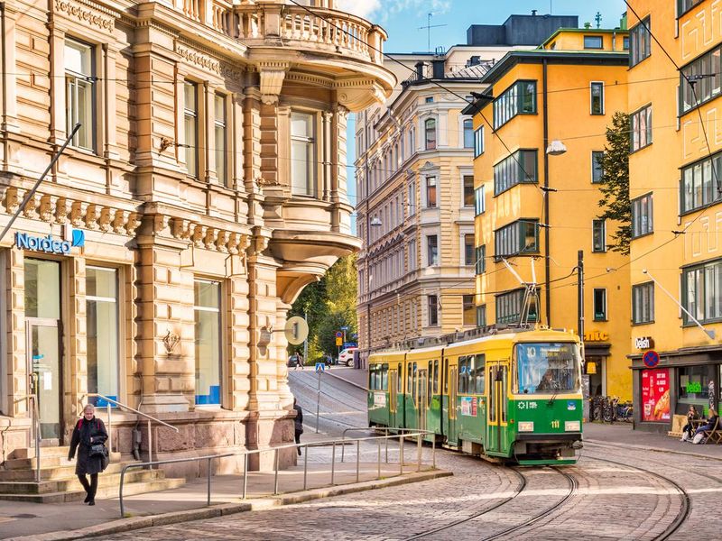 Typical green-yellow tram in downtown Helsinki Finland