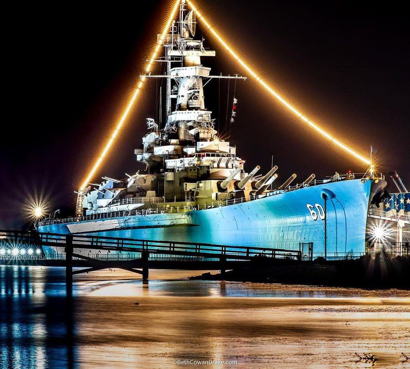 USS Alabama at night on the perfect road trip map