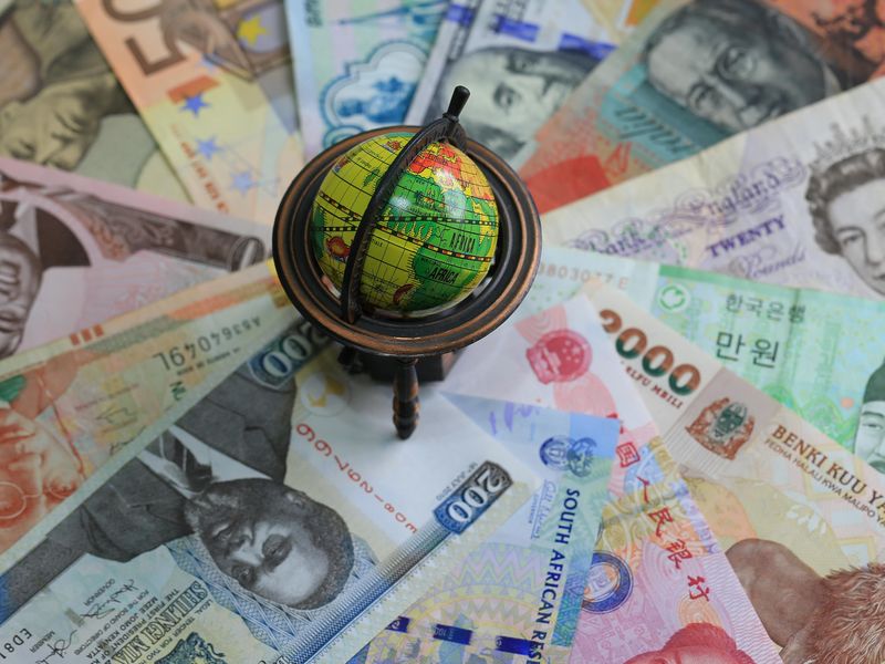 Valuable currencies and globe