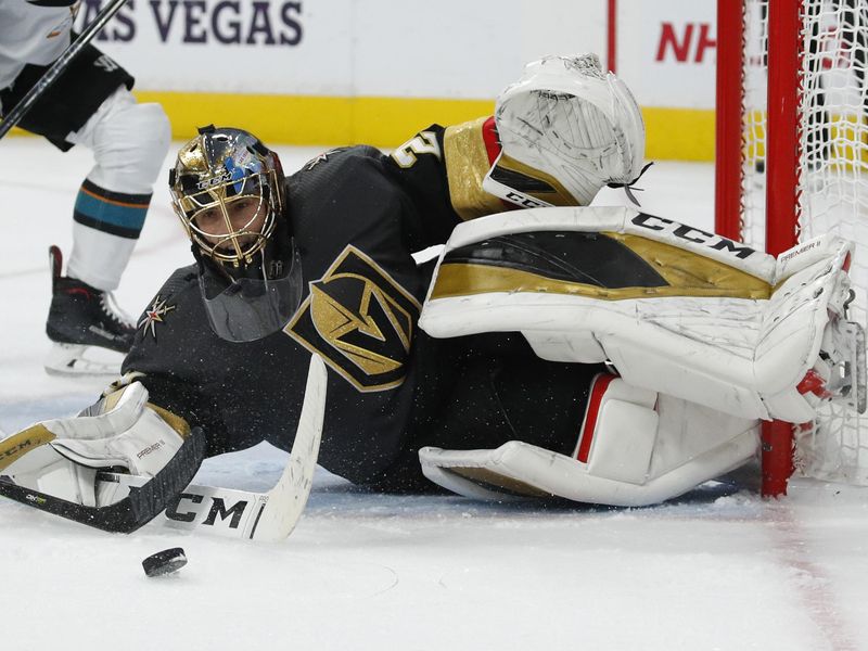 Vegas Golden Knights goaltender Marc-Andre Fleury blocks a shot by San Jose Sharks