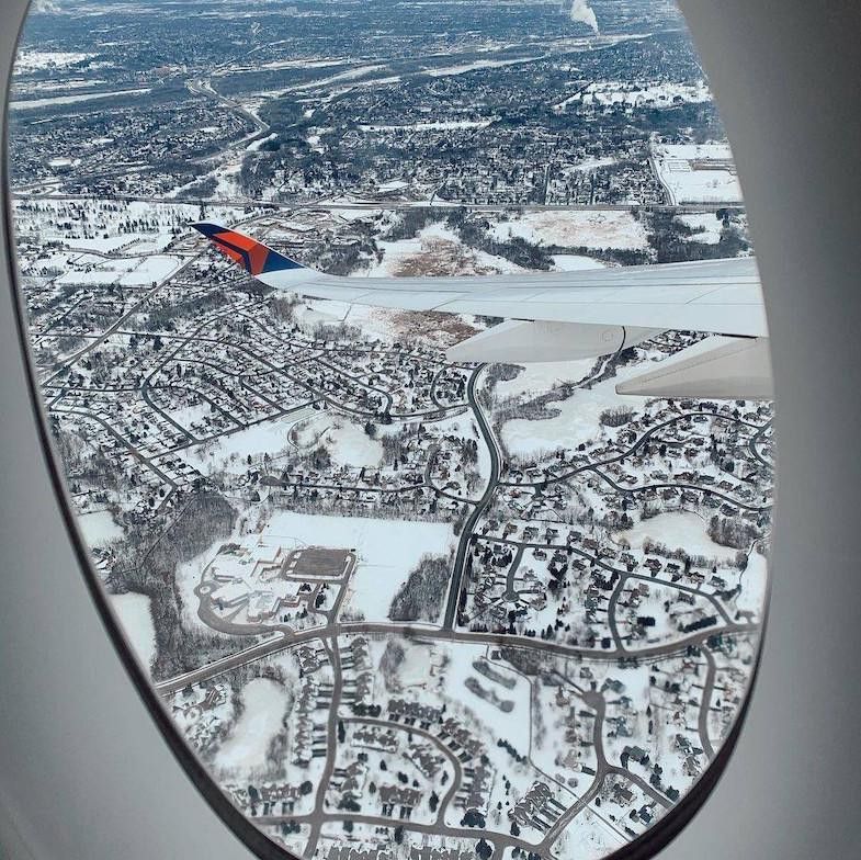View of snowy landscape from Delta aircraft