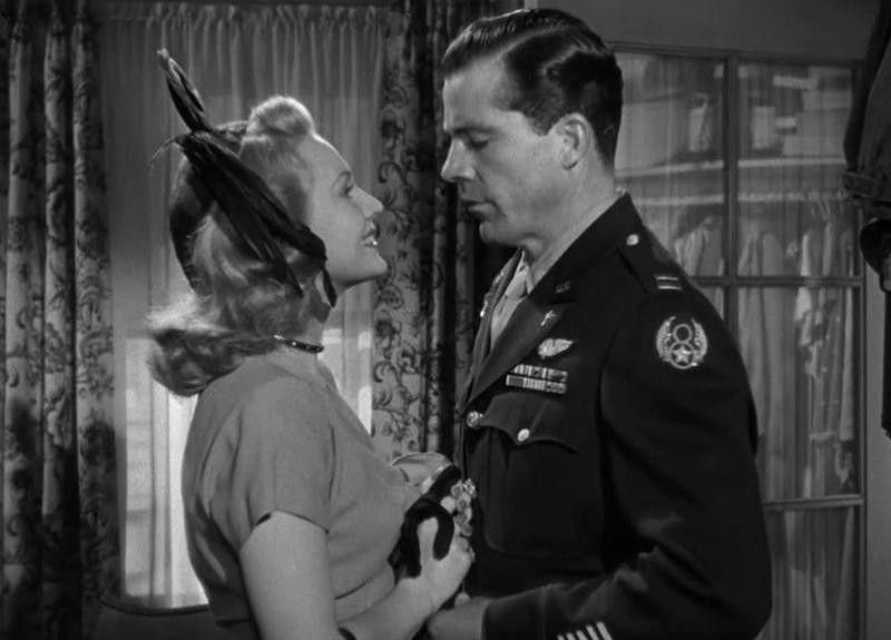 Virginia Mayo smiling at Dana Andrews in The Best Years of Our Lives